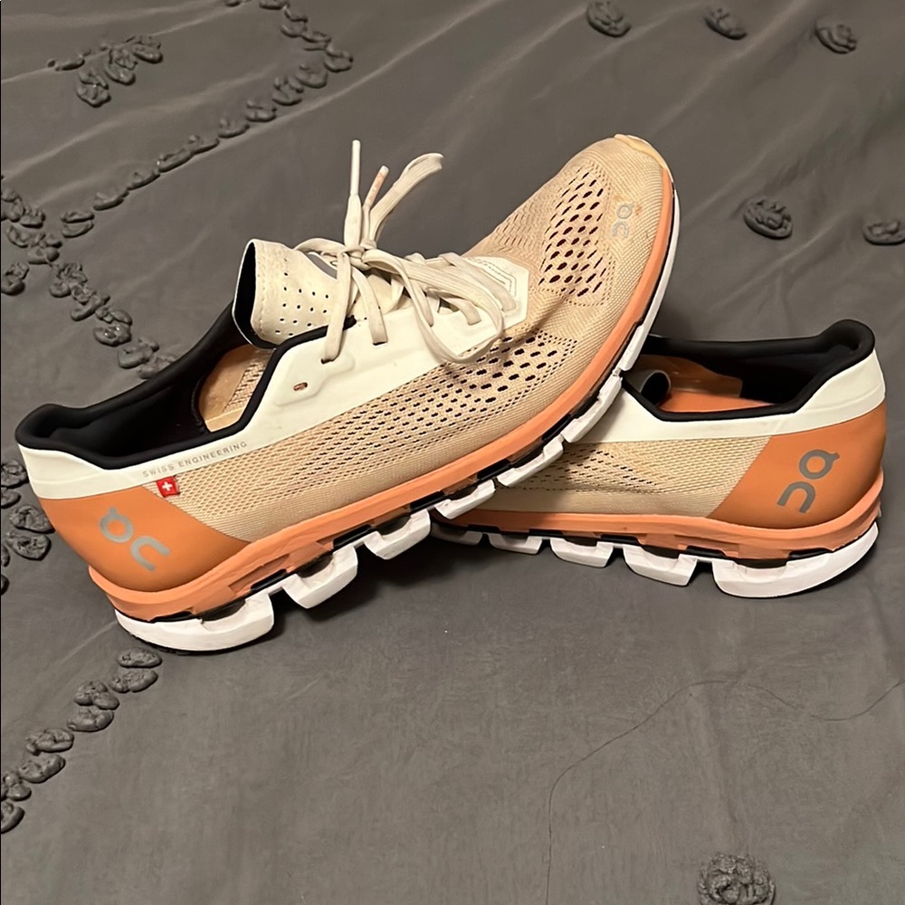 On Running Cream and Orange Athletic Shoes with Cloud Technology